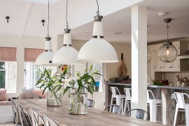 Natural materials and decor give the beach style dining a serene look