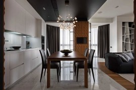 Open plan living area with a sleek kitchen and smart dining space