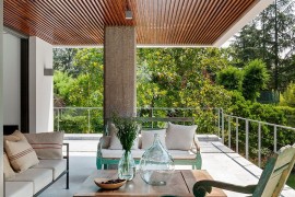 Pergola inspired design of the roof keeps away the sun