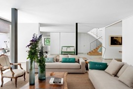 Pops of turquoise and antique decor pieces enliven the space