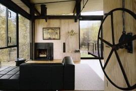 Refreshing living area of the cabin with glass walls