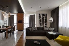 Scupltural wood panels on the wall add texture to the contemporary home