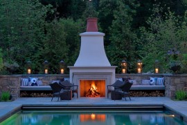 Seating next to the fireplace doubles as firewood storage space