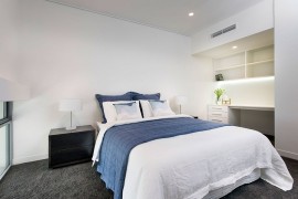 Small workstation in the corner of the contemporary bedroom