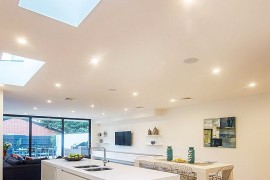 Smart ceiling design brings natural light to the lower level of the home