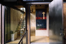 Steel walkway leading to the entrance of the cabin