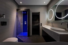 Stunning master bath design in gray with gorgeous lighting