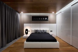 Wooden surfaces and drapes keep out the street noise with ease