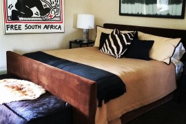 Accent pillow with zebra stripes instantly grabs attention in the bedroom