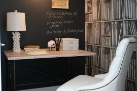 Beautiful home office with chalkboard wall and Fornasetti wallpaper