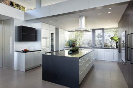 Contemporary kitchen in black and white with garden views
