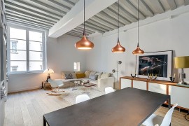 Copper pendants add metallic magic to the lovely bachelor pad