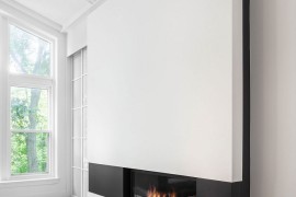 Fabulous, sleek fireplace adds to the appeal of the contemporary addition