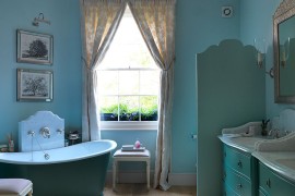 Lovely use of blue in the eclectic bathroom