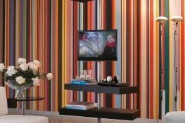 Minimal and elegant TV stand relies on a metal pole