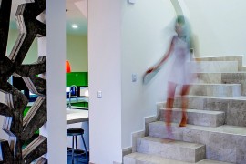 Open interiors of the Nest House where one room flows into the next