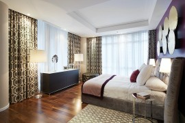 Plush decor and natural light turn the bedroom into a personal haven