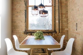 Small industrial style dining room with lovely lighting
