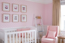 Vintage framed pictures and a ladder shelf in the lovely nursery