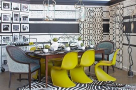 Gray and white provide the perfect backdrop of brilliant accent hues in the dining room