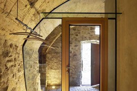 Lighting brings cozy warmth to the renovated stone house