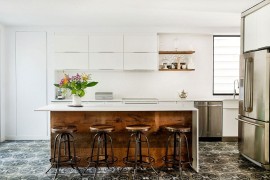 Reclaimed wood adds warmth to the contemporary kitchen in white