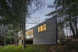 Smart exterior of the cabin blends visuall with the landscape around it