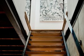 Wall art adds a hint of playful charm to the staircase landing