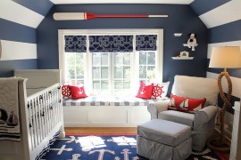 White and dark blue stripes along with decor usher in the nautical look