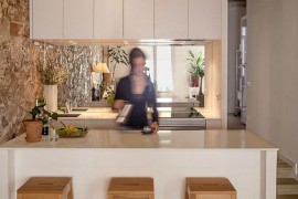 All-white kitchen in renovated nineteenth century apartment in Barcelona