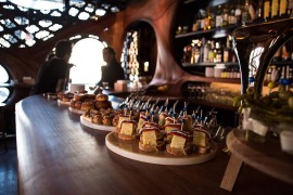 Bar Raval Toronto steals the show with its CNC'd mahogany interior