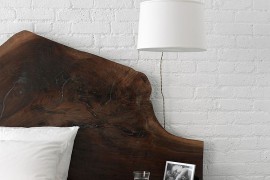 Beautiful headboard stands out thanks to the all-white backdrop