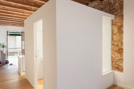 Central cube of the apartment holds the bathroom and the kitchen