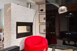 Classic Pumpkin Chair by Pierre Paulinin bright red enlivens the modern interior