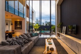 Cozy couch seems to borrow from the colors and shades of raw concrete