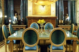 Dazzling dining room in blue and gold with custom drapes and decor