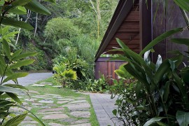 Entrance to the private house is concealed by natural greenery