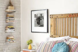Freight elevator door turned into a smart headboard in the industrial bedroom