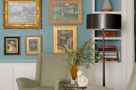 Gallery wall along with floating shelves creates a lovely display