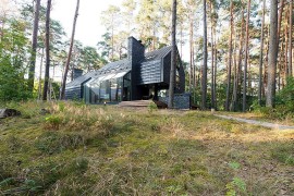 Gorgeous Black House Blues in Lithuania surrounded by forest