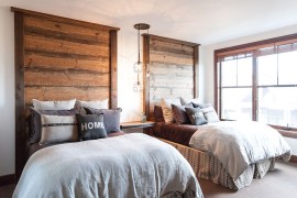 Headboards and light fixture steal the show in this bedroom