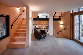 Living area of the renovated mill home with framed views