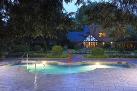 Lovely modified rectangular pool with a stamped concrete deck