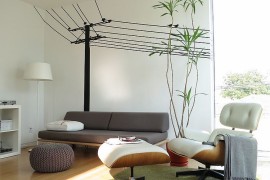 Modern family room with the Case Study Daybed and the Eames Lounger