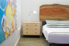 Natural wood headboard in the contemporary bedroom