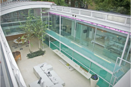 Pool Enclosed Inside Glass Residence