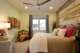 Reclaimed barn wood finds its way into the rustic bedroom