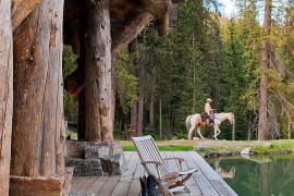 Relaxing porch of the Headwaters camp cabin exudes umatched rustic beauty