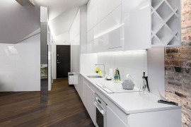 Sleek kitchen workdstation in white makes smart use of space