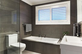Sleek, modern bathroom in gray and white